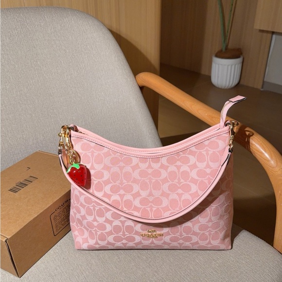 Coach Handbags - Coach Pink Signature Canvas Shoulder Bag with Strawberry Charm